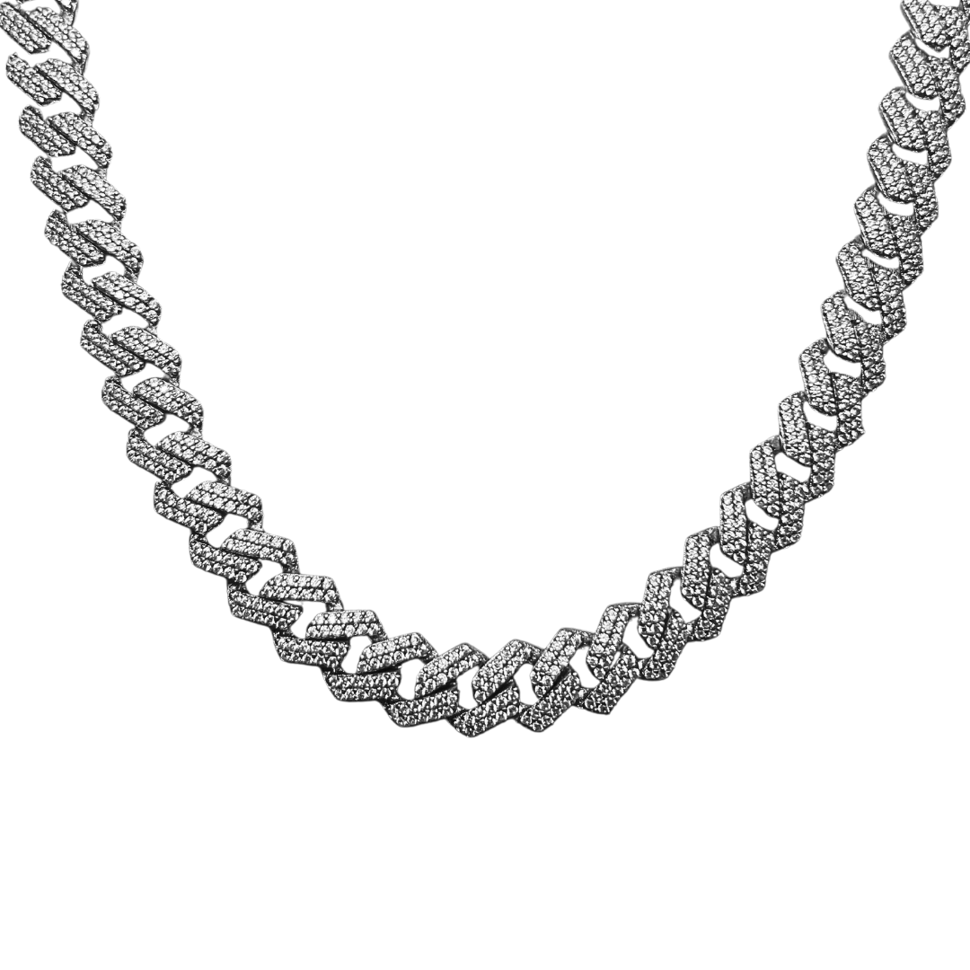 A silver cuban link chain necklace with intricate design and diamond embellishments.